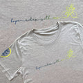 Gray t-shirt with 'hope rides with me' text and cycling graphics on a gray background